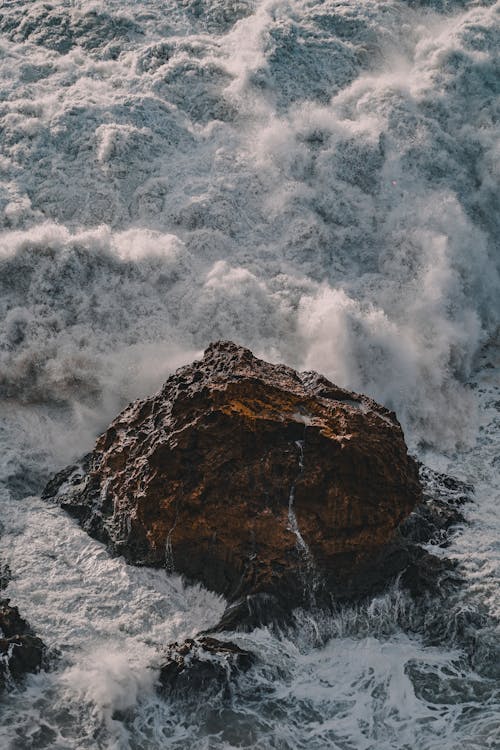 View of a Rock an Foamy Waves 