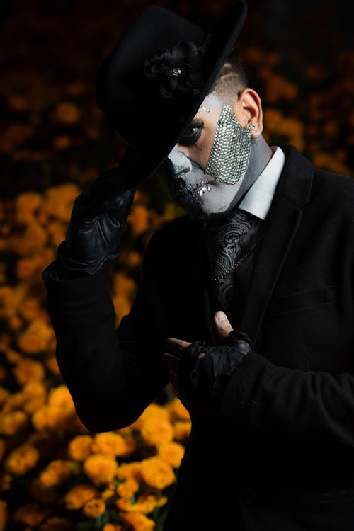 Portrait of Man with Painted Face and in Hat for Dia de Muertos