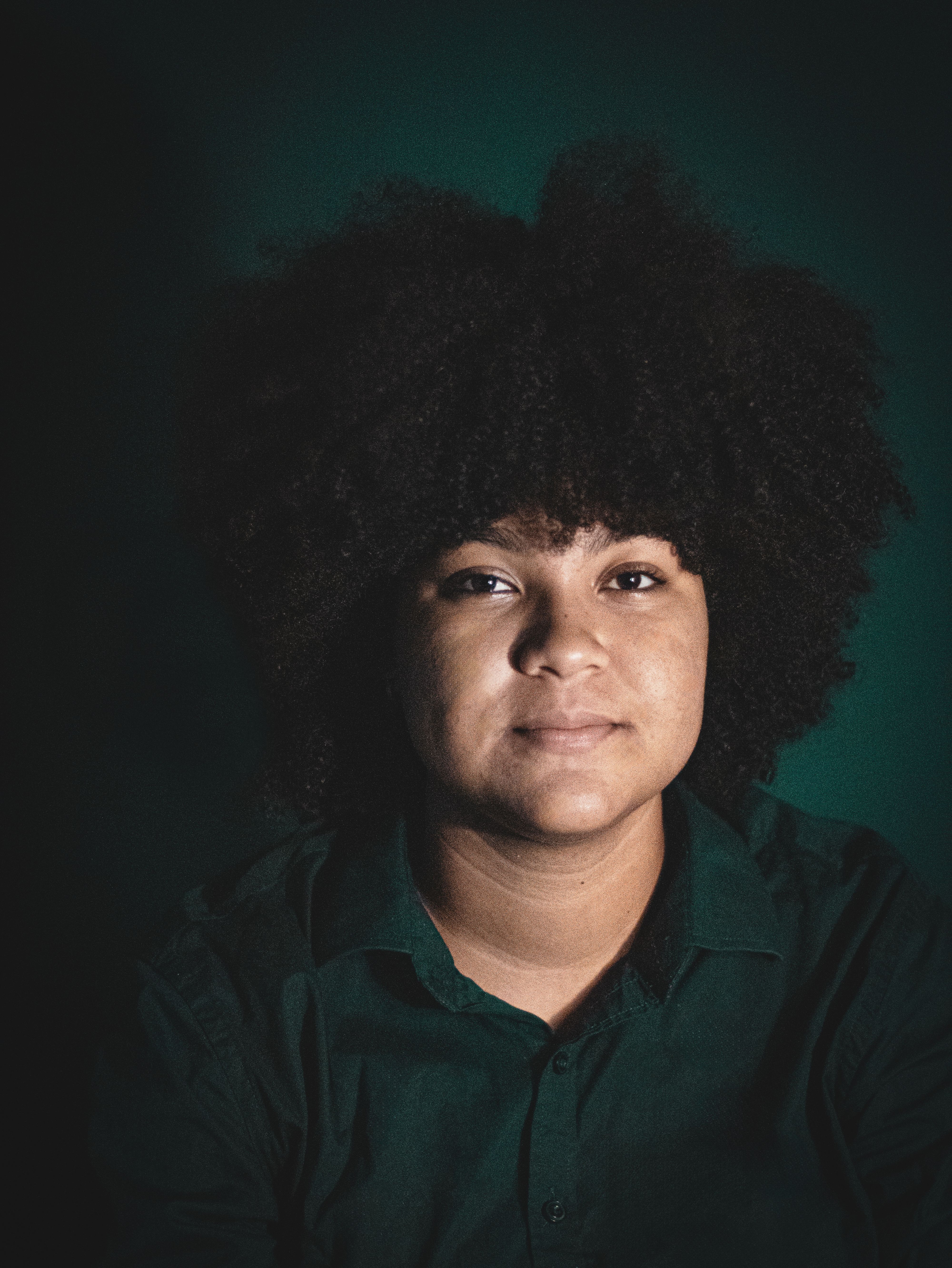 Portrait of Woman with Curly Hair · Free Stock Photo
