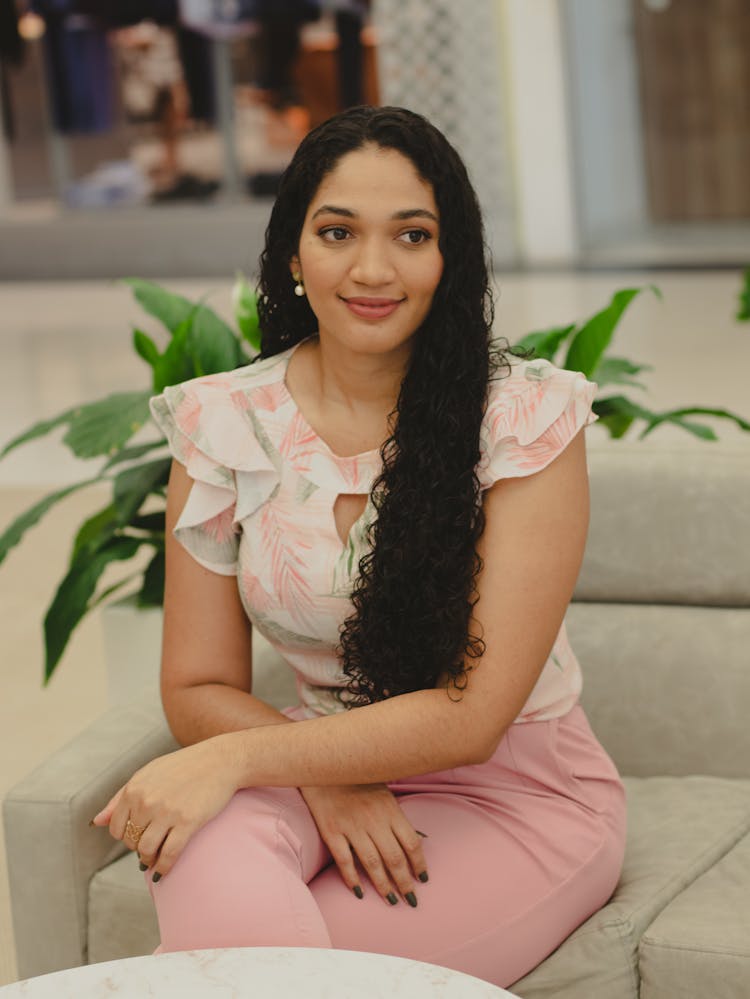 Smiling Woman Sitting On Couch