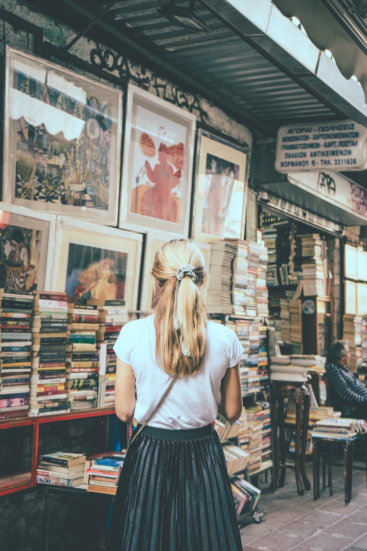 Woman On A Book Market On A Street 