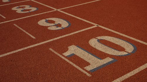 Close-up of Numbers on the Surface of an Athletics Track