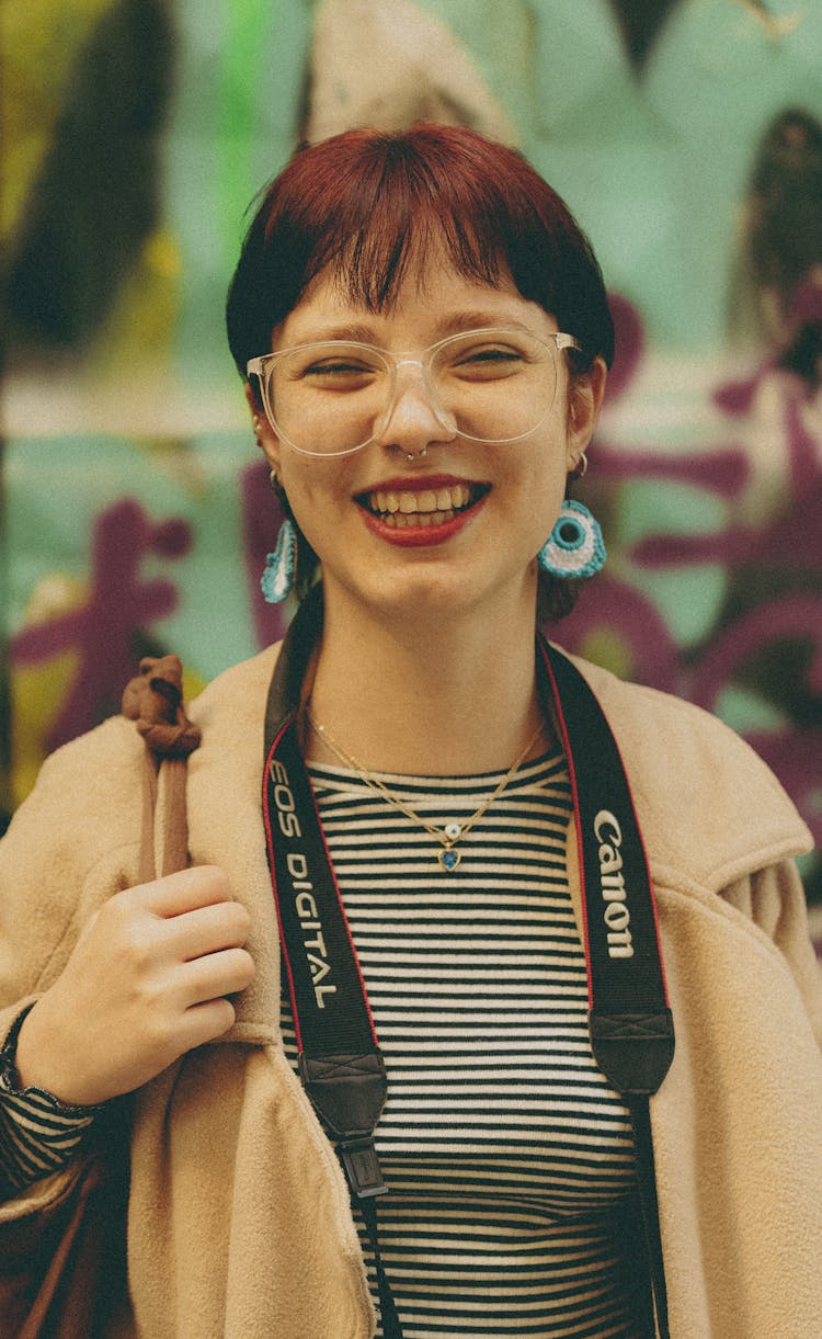 Portrait Of Young Woman With Camera