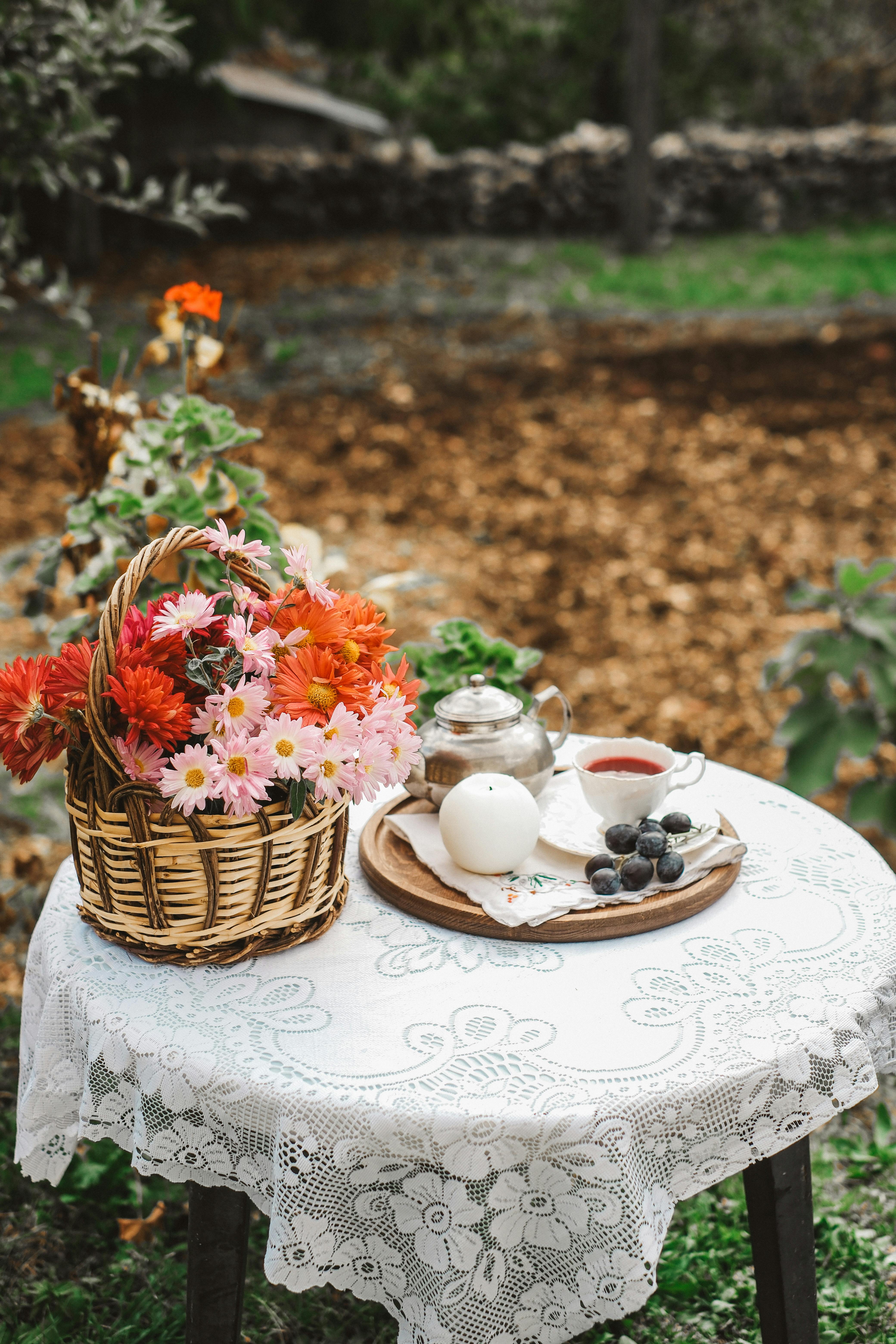 Woman Sitting at Table with Retro Tea Set · Free Stock Photo