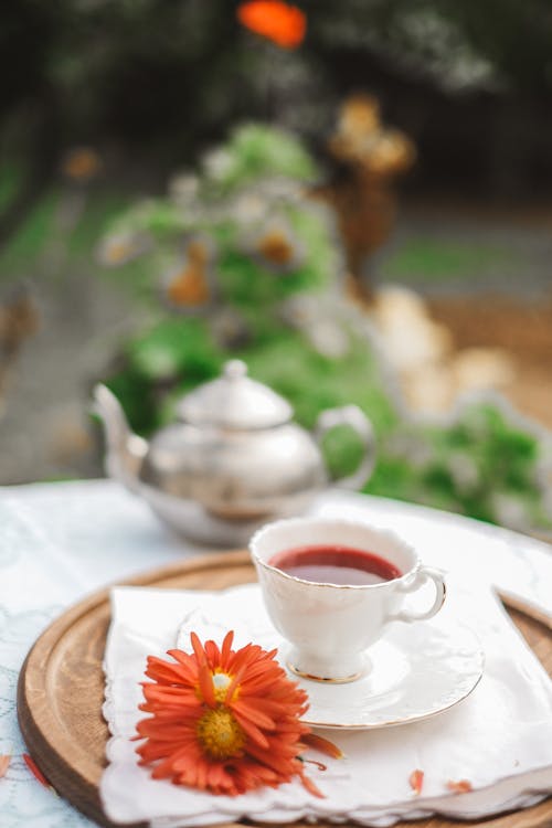 A Cup of Tea and a Flower on the Table 