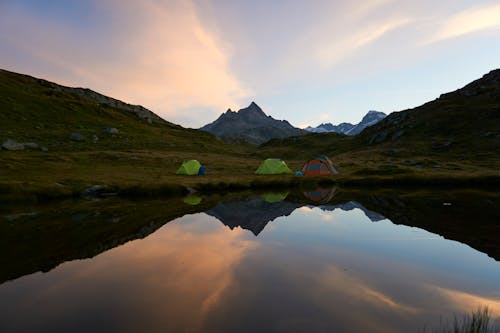Tents next to a Lake in a Mountain Valley 