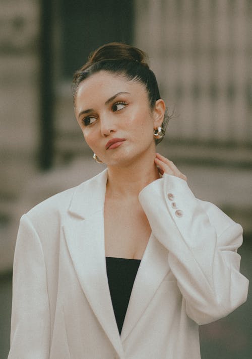 Portrait of Elegant Woman Wearing White Blazer 