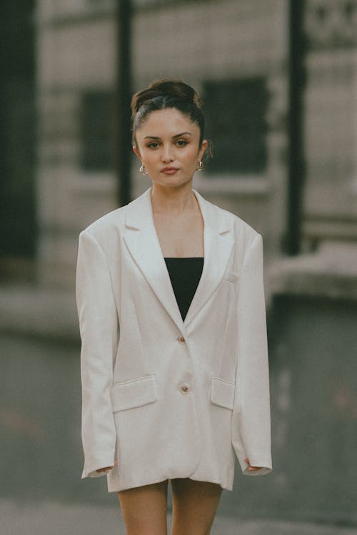 Young Woman in a Blazer Posing on the Street