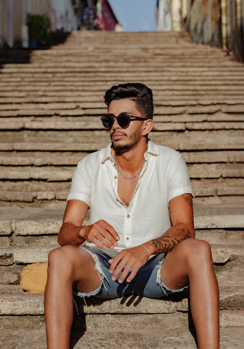 Man Sitting on Steps in Sunlight 