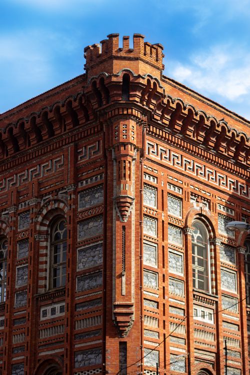 Free Detailed view of a historic red brick building with ornate designs in Istanbul, Turkey. Stock Photo