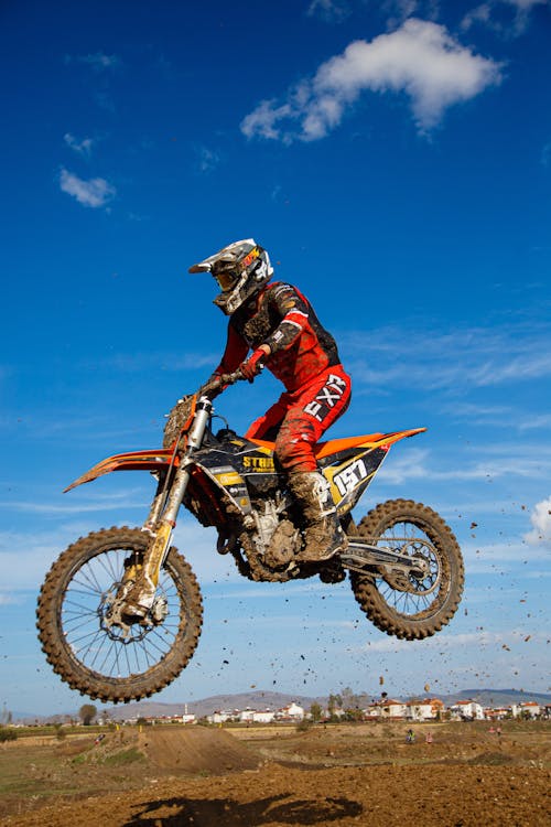 A Man Jumping on a Motorcycle