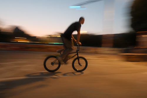 Blurred Man Riding Bike