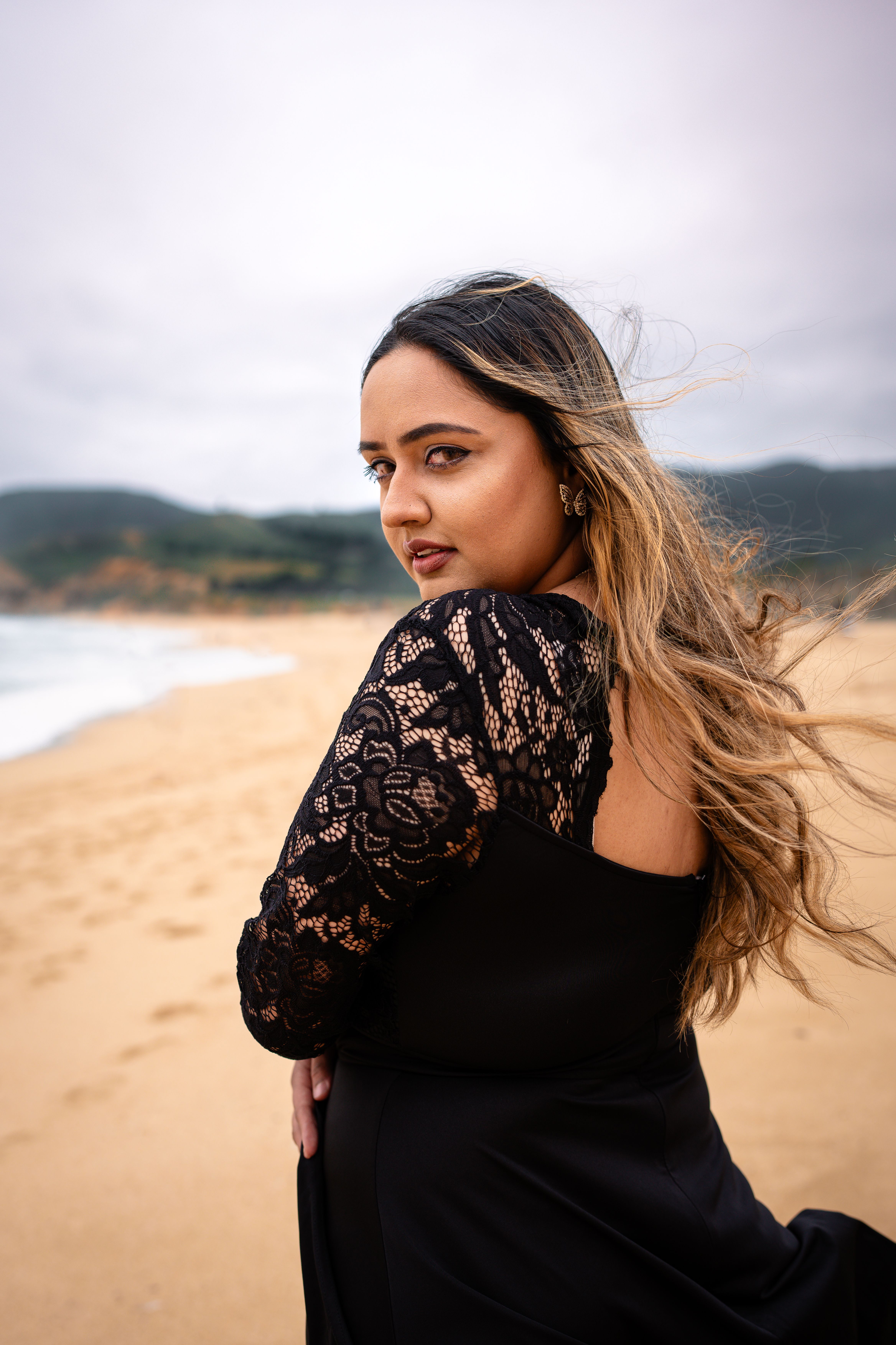 Model in Black Dress on Beach  Free Stock Photo