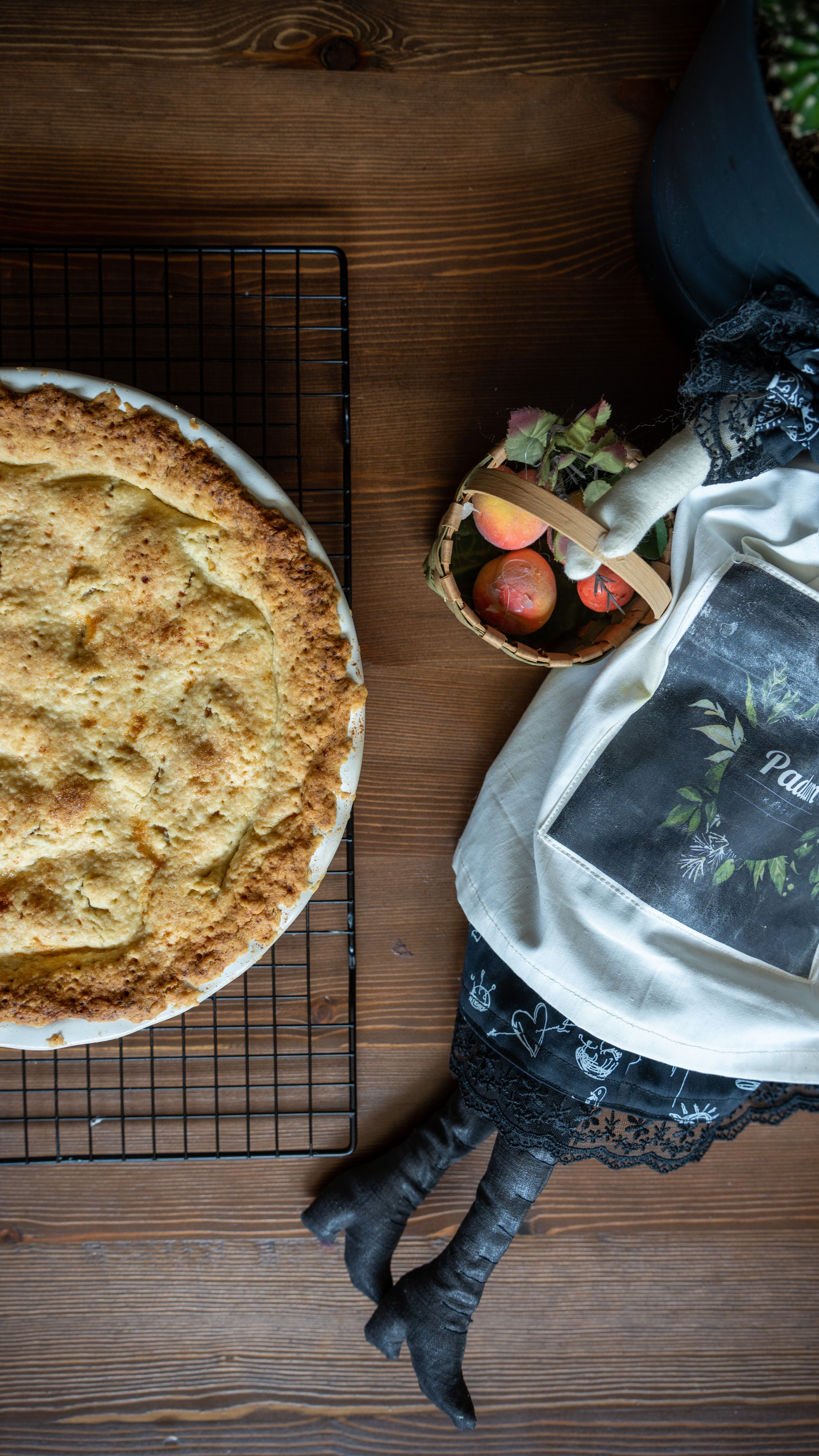 A rustic homemade pie cooling on a rack