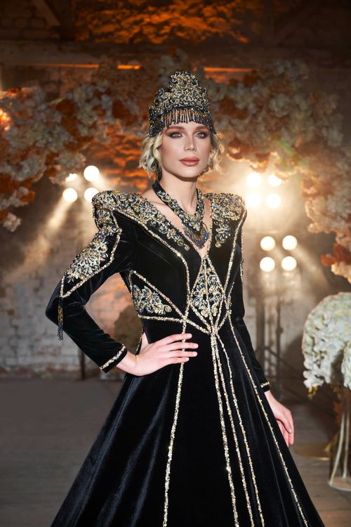 Free A woman in an ornate black evening dress at a fashion shoot in İzmir. Stock Photo
