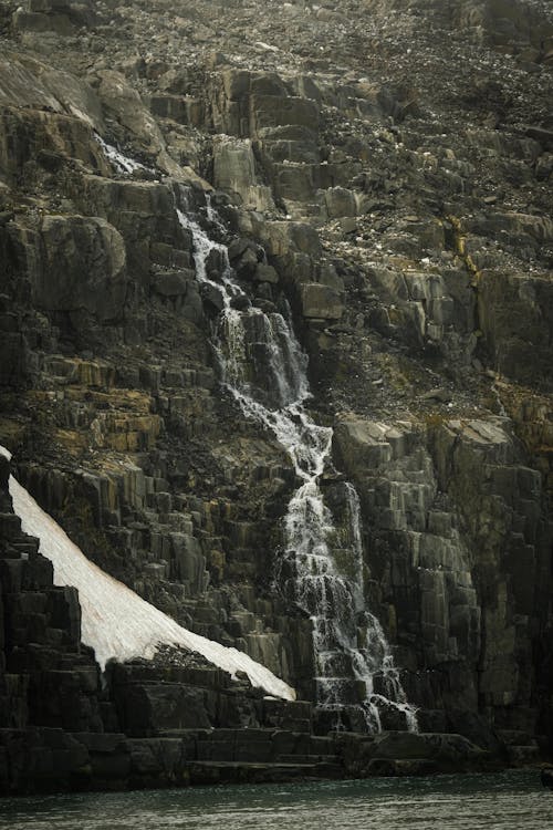 Waterfall on a Cliff with a Rough Texture
