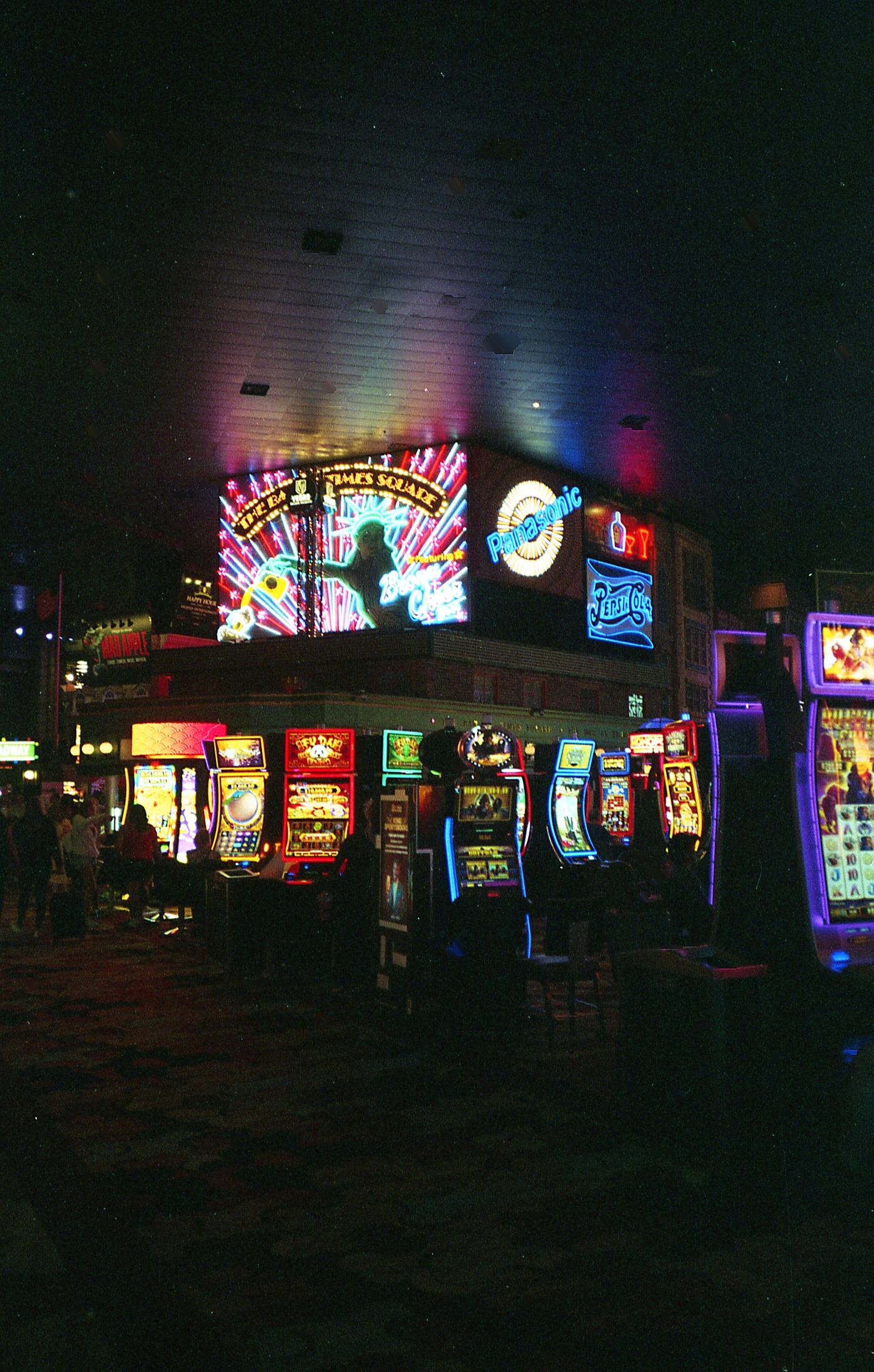 Vibrant Las Vegas-style casino scene filled with colorful neon lights and slot machines