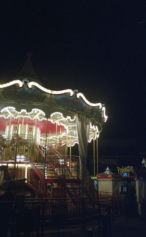 Free A vibrant illuminated carousel captures the magic of a San Francisco night. Stock Photo
