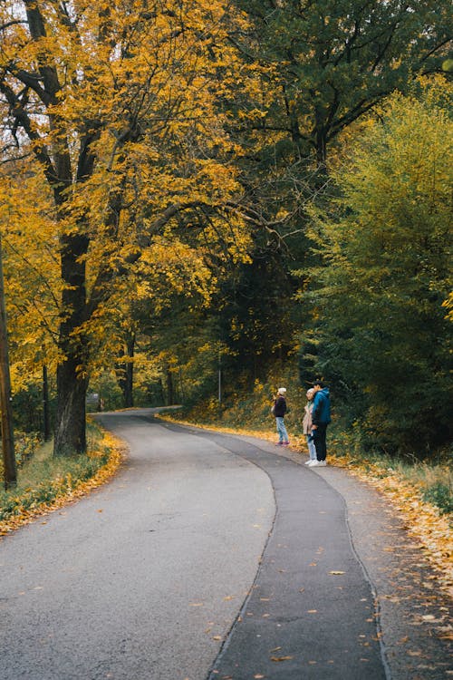 People on Road in Countryside in Autumn