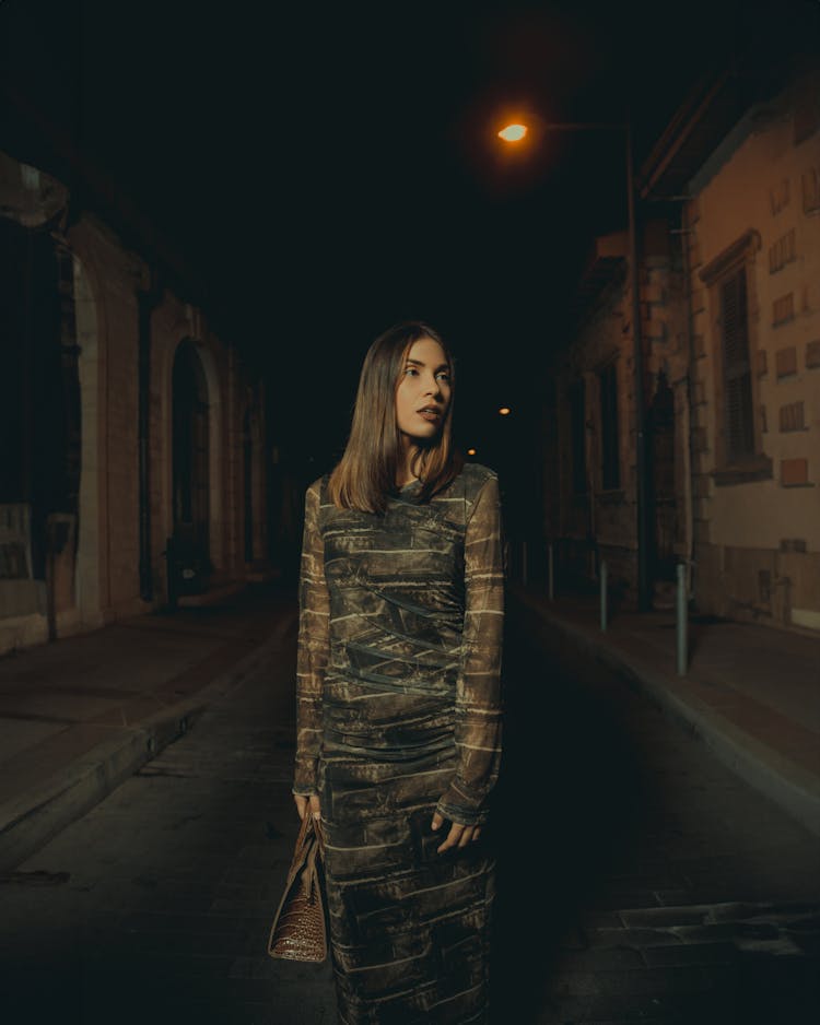 Woman In Dress In Town At Night