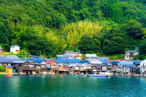 Free Charming boathouses on the waterfront in Ine, Kyoto, surrounded by lush forests. Stock Photo