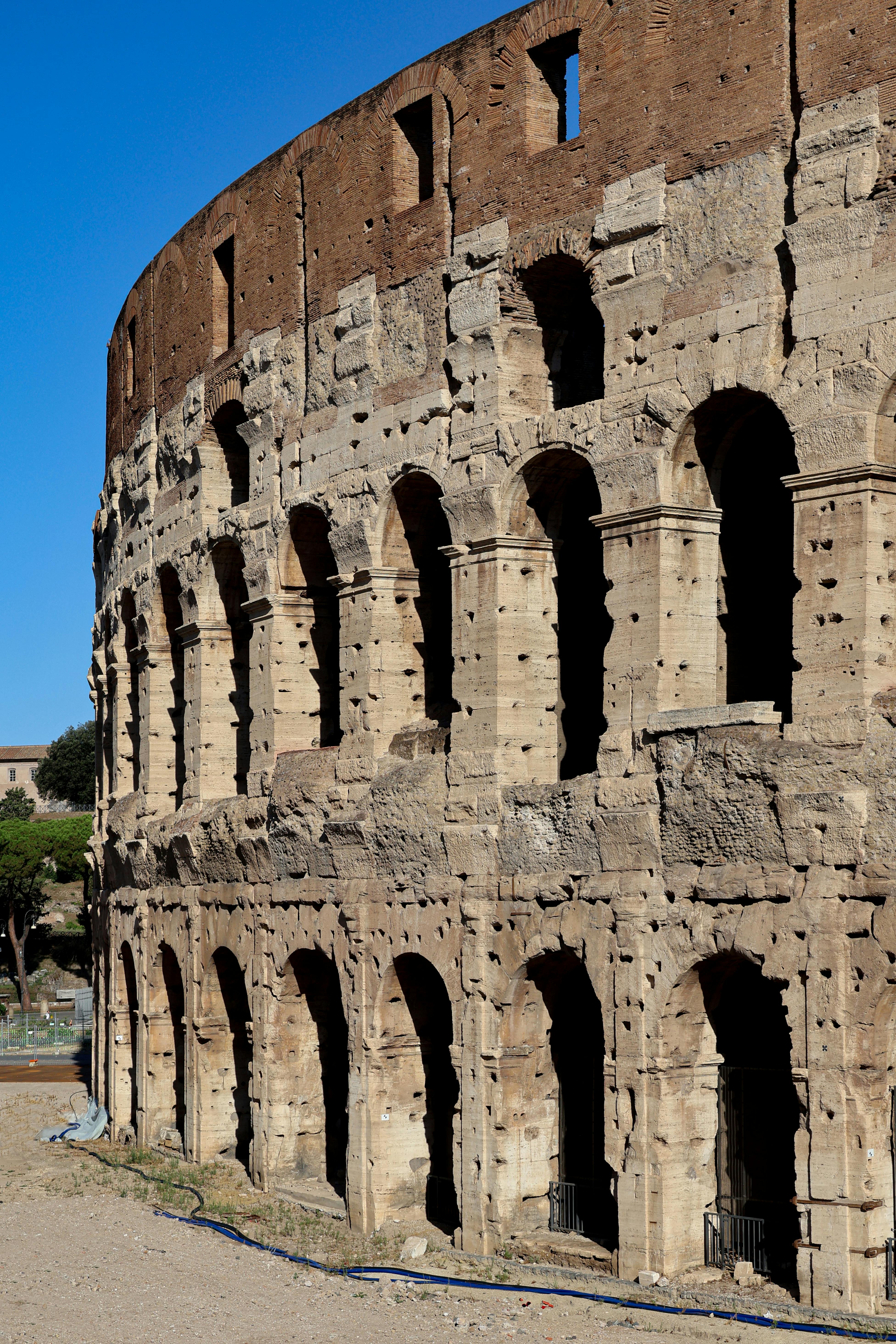 Free Historic Colosseum in Rome, showcasing ancient architecture on a sunny day. Stock Photo