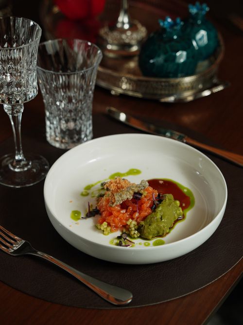Free A gourmet seafood dish served elegantly with crystal glassware in a dining setting. Stock Photo