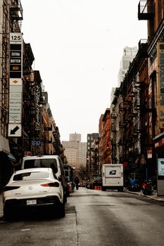 Vibrant city street in NYC with bustling life and iconic architecture.