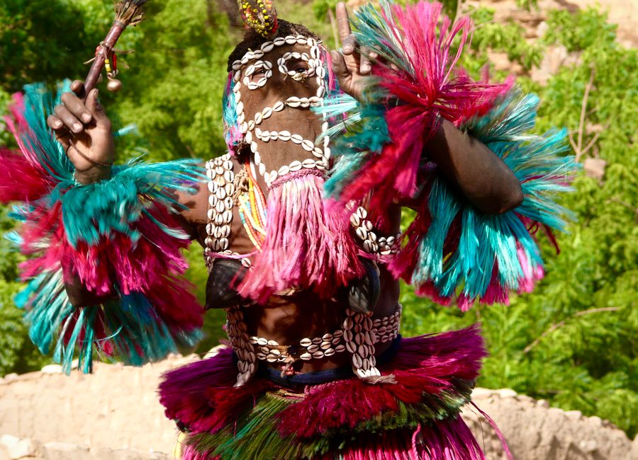 Vibrant traditional dance performed in colorful attire during Malian celebration.