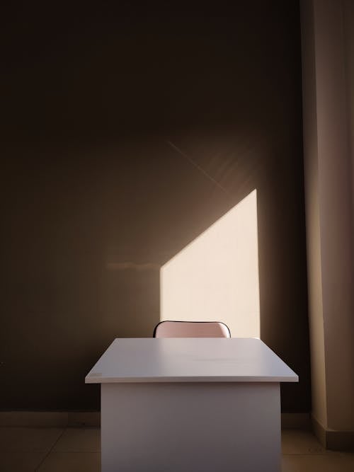 Free Abstract Image of a Minimalist Interior with a Light on the Wall Stock Photo