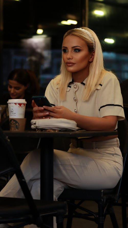 Young Woman Sitting in a Cafe