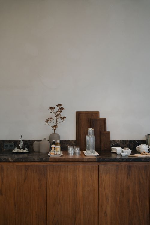 Free Stylish minimalist kitchen interior with wooden elements and cutting boards in Amsterdam. Stock Photo