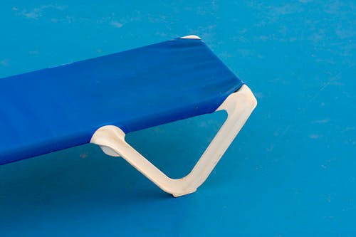 Lounge Chair against a Blue Background 