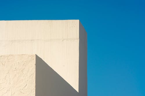 White Building Walls and Blue Sky around