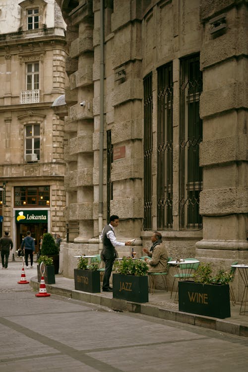 A Street and Old Building with a Restaurant in City 