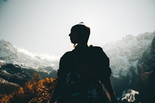 Silhouette of Woman in a Mountain Valley 