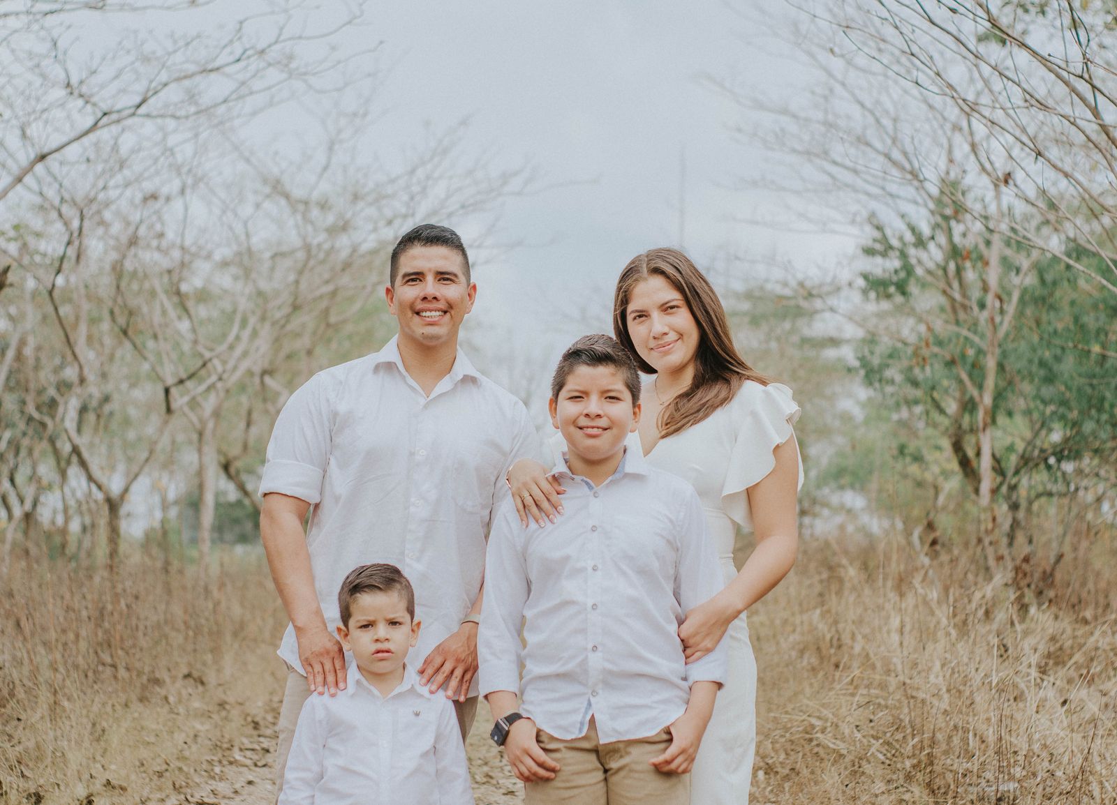 A joyful family we've helped, together in a warm, natural setting