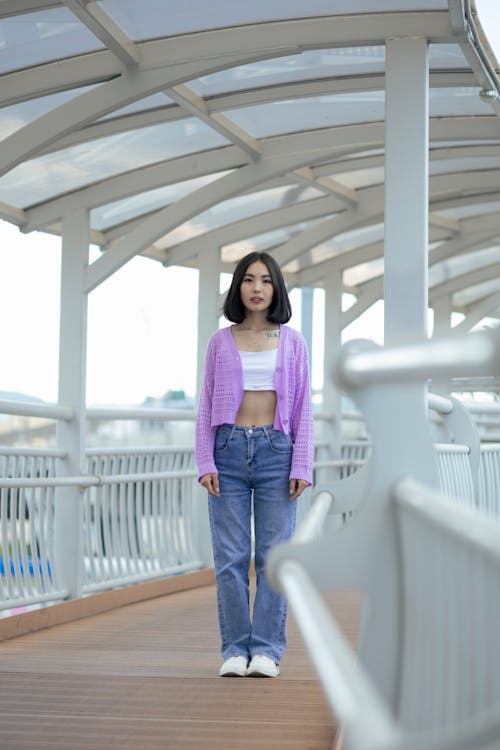 Young Brunette Woman Standing on Footbridge