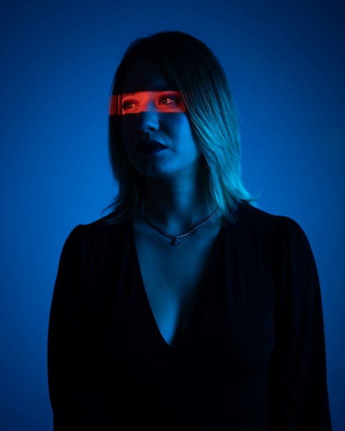 Studio Shot of a Young Woman in Blue Lighting 