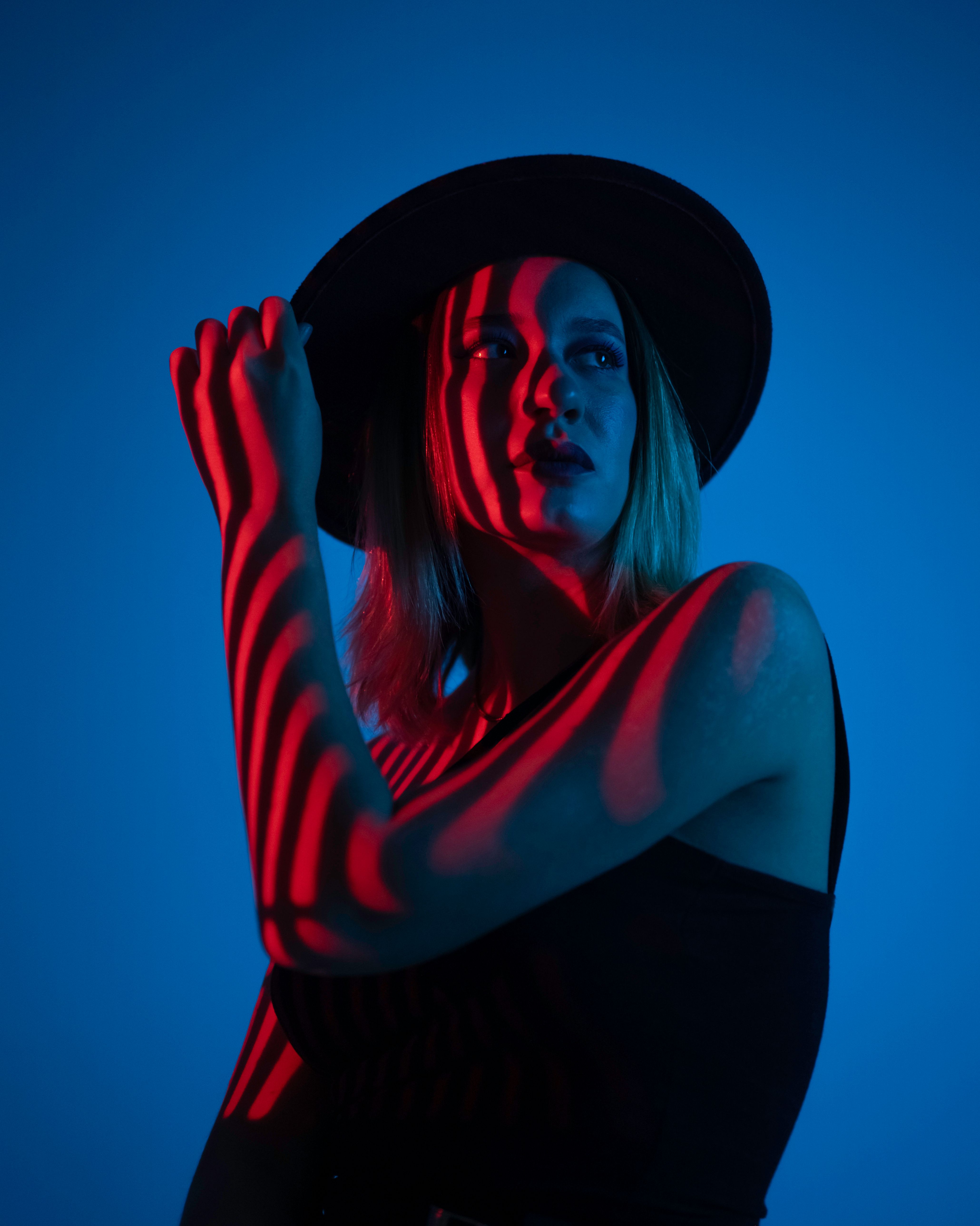 Studio Shot of a Young Woman in Blue Lighting · Free Stock Photo