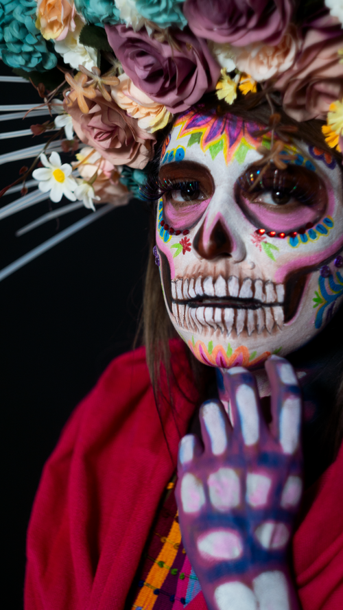 Free Closeup of colorful Day of the Dead makeup with floral headpiece, capturing Mexican tradition. Stock Photo
