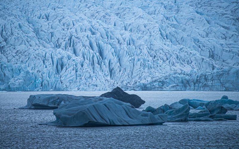 Icebergs beside a glacier front — photo by Chad Hicks on Pexels