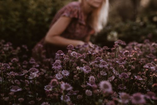 Flowers in Front of Woman in Garden