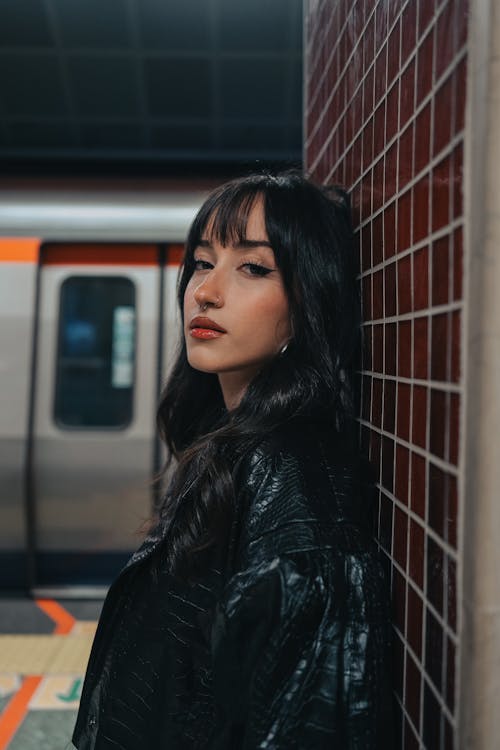 Brunette in Leather Jacket Posing at Subway Station
