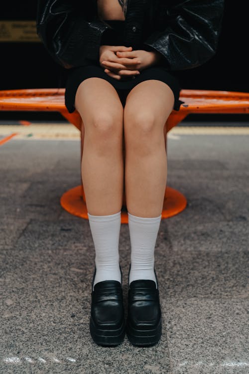 Model Wearing Mini and White Sock to Black Shoes