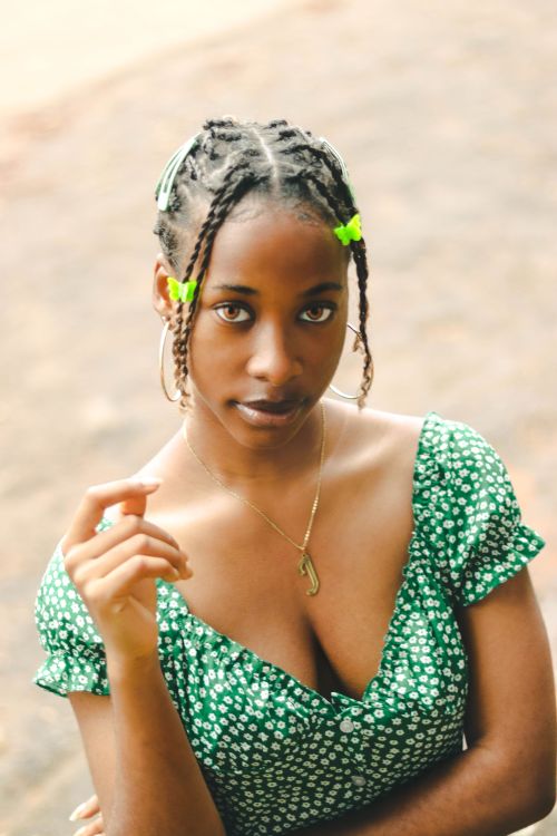 Young Woman With Braided Hair in a Green Dress · Free Stock Photo