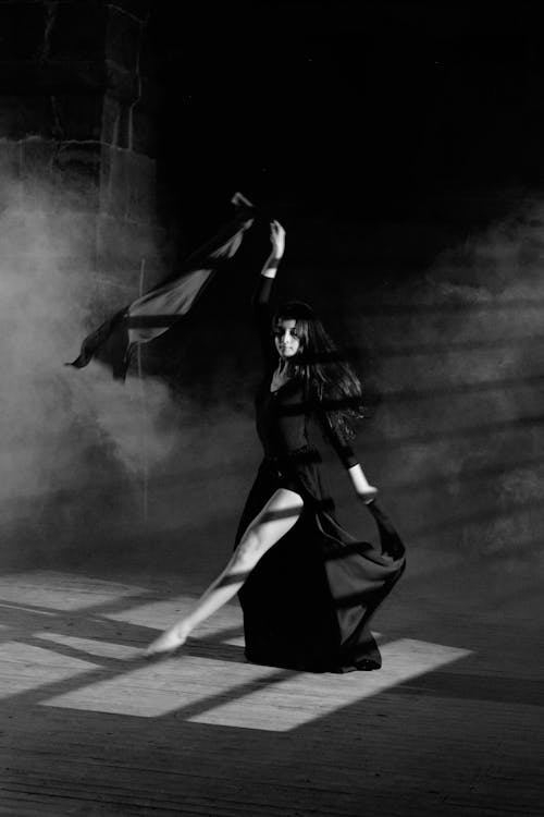 Model Dancing in Black Clothes in Black and White