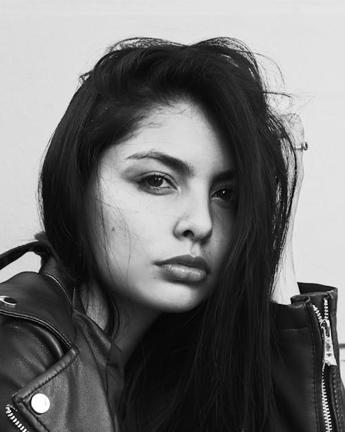 Black and White Portrait of a Young Woman in a Leather Jacket