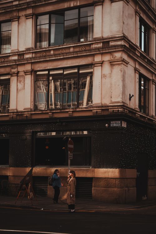 Free Street view of Hilton Street, Manchester with people and historic architecture. Stock Photo