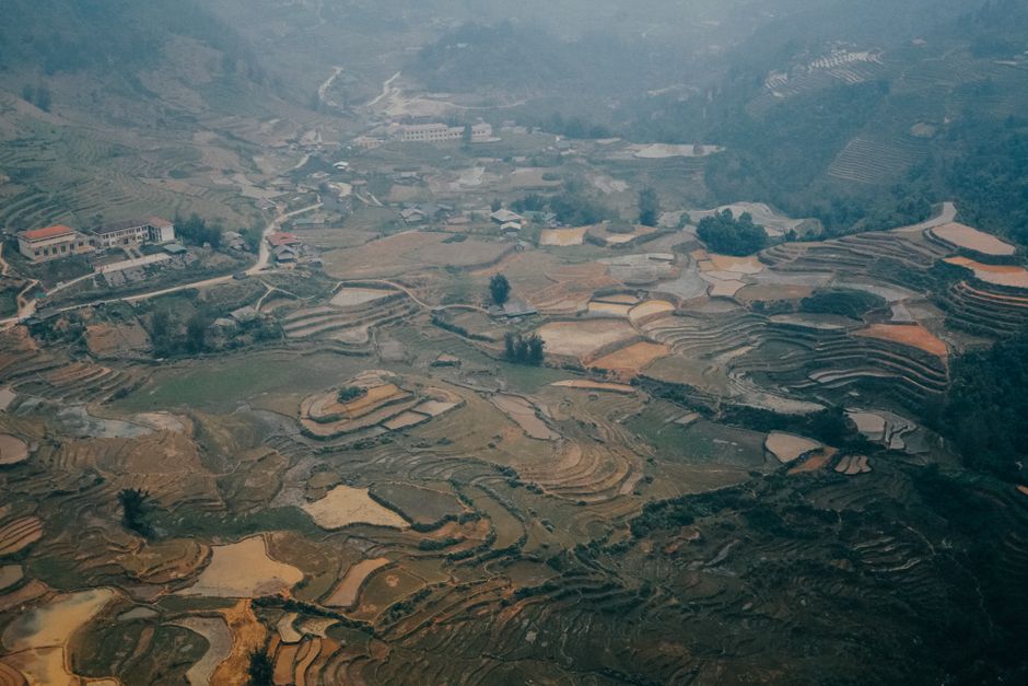 Stunning aerial view of terraced rice fields in a rural landscape, perfect for nature lovers.